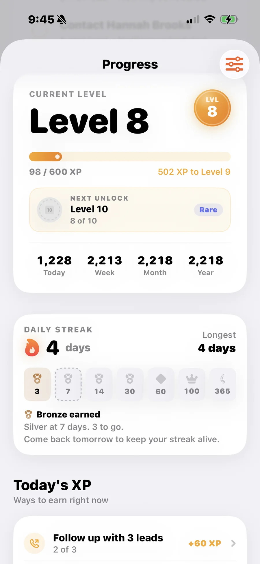 The Zignin Progress screen on iPhone showing the current level, XP toward the next level, a daily streak and streak milestone badges